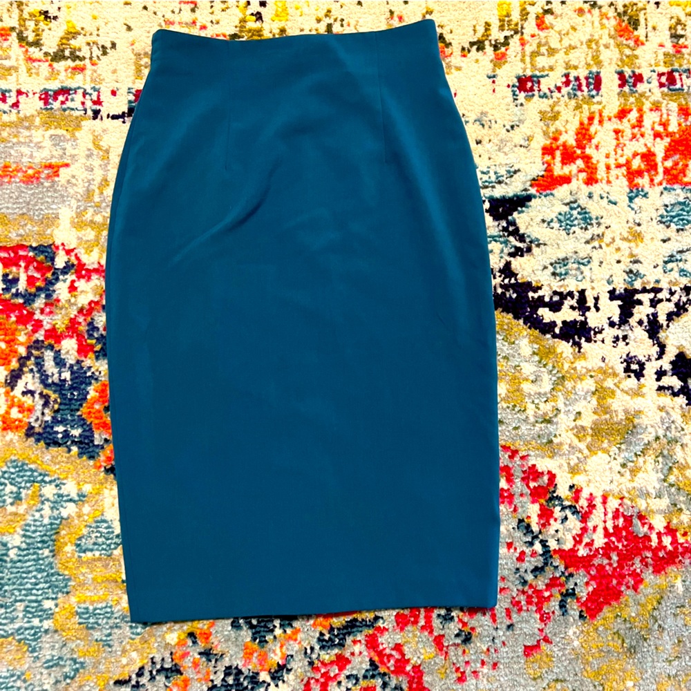 Woman’s teal blue pencil skirt